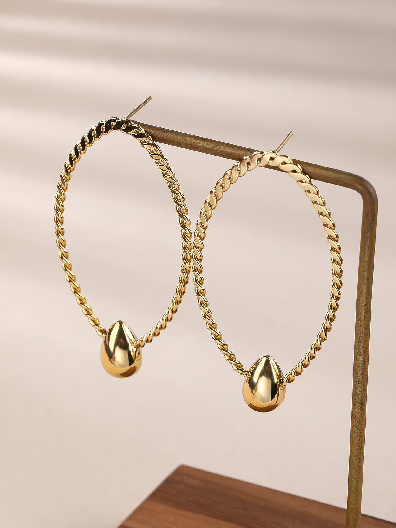 Golden Braided Oval Earrings With Teardrop